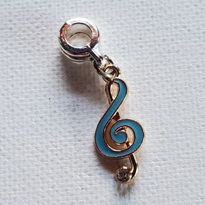 Charm. Silver and gold tone. NWOT.  Fits in Pandora snake chain Bracelet.